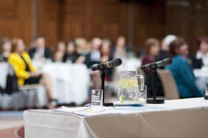 business conference water glasses mic long table