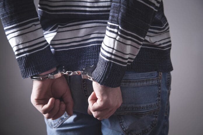 man in handcuffs law crime criminal
