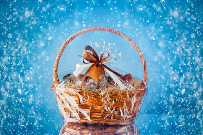 Gift basket with festive particles, blue background