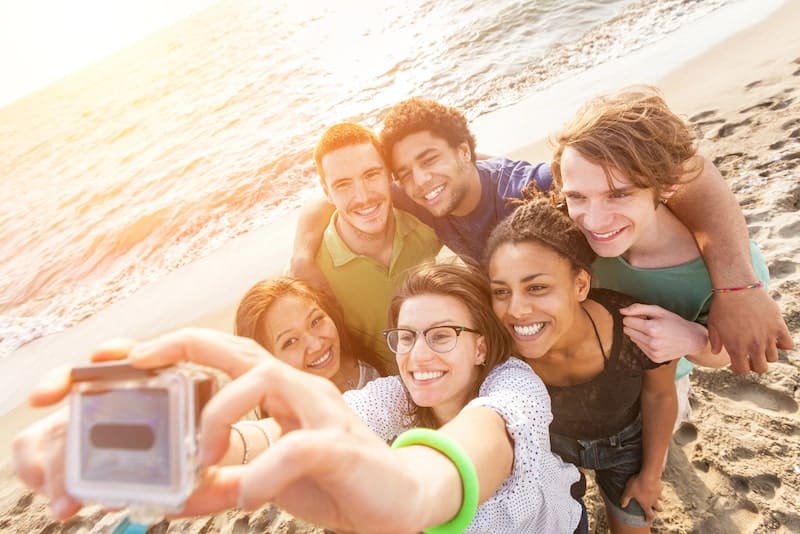 Multiracial Group of Friends Taking Selfie at Beach
