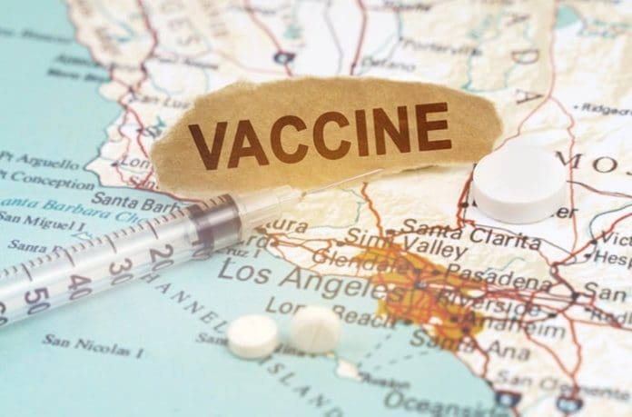 Medicine and health concept. On a map of California lies a syringe