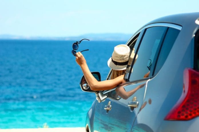 girl looking out of car beautiful blue water sea
