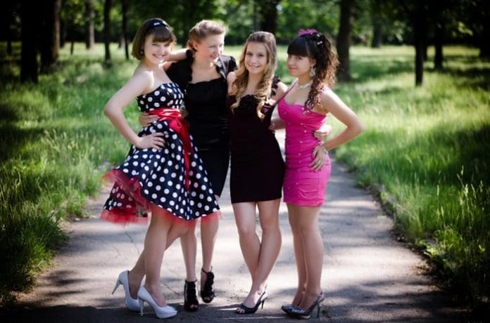 girls wearing short homecoming dresses