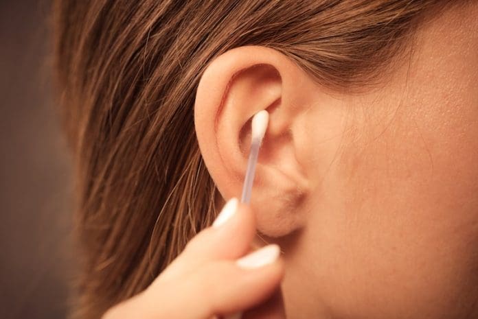 woman cleaning ear close shot