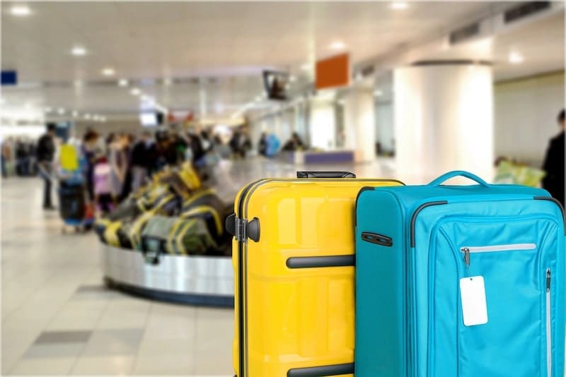 Large suitcases on background