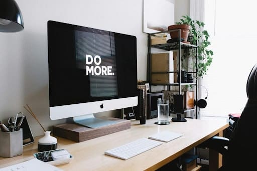 do more phrase on black screen computer desk