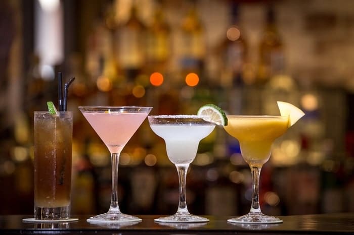 margaritas and cosmos on bar