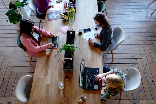 women co-working space desk